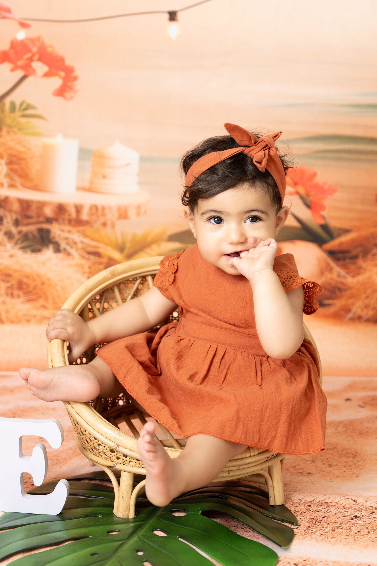 Baby enjoying a fun Cake Smash Photoshoot Dubai with pastel cake and themed setup in a professional photography studio Dubai