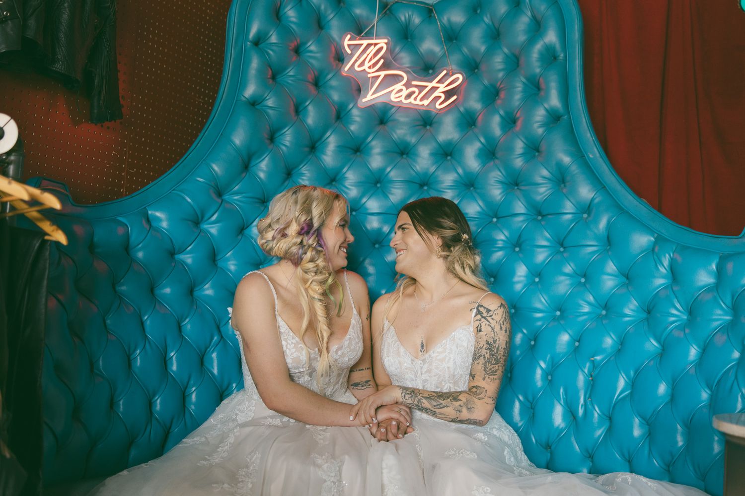 two brides holding hands in vintage wedding venue in Asheville NC for lgbtq elopement wedding