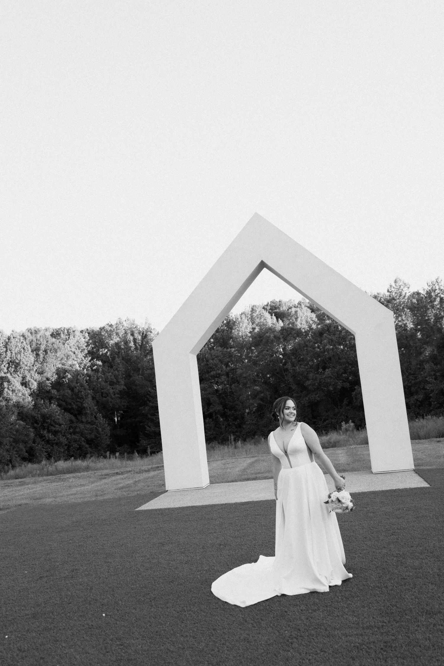 A sequence of black and white photos showing a figure in white dress against geometric architectural elements outdoors.