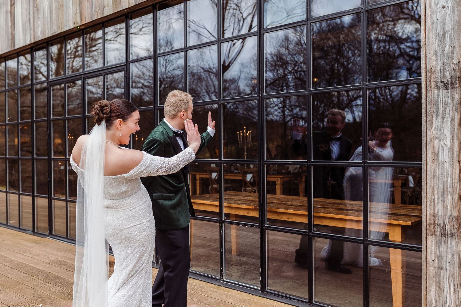Bride and groom wave at guests