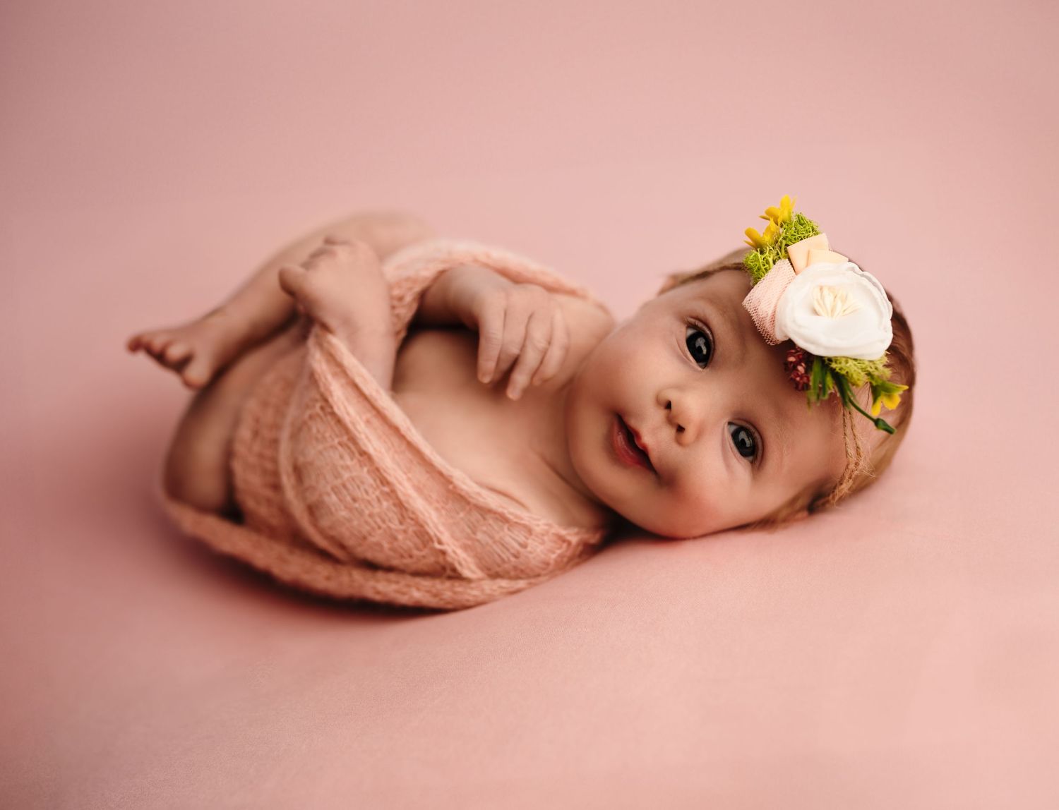 Charlottesville, Virginia newborn photographer, baby in pink wrap and headband, eyes open, smile, maternity, family