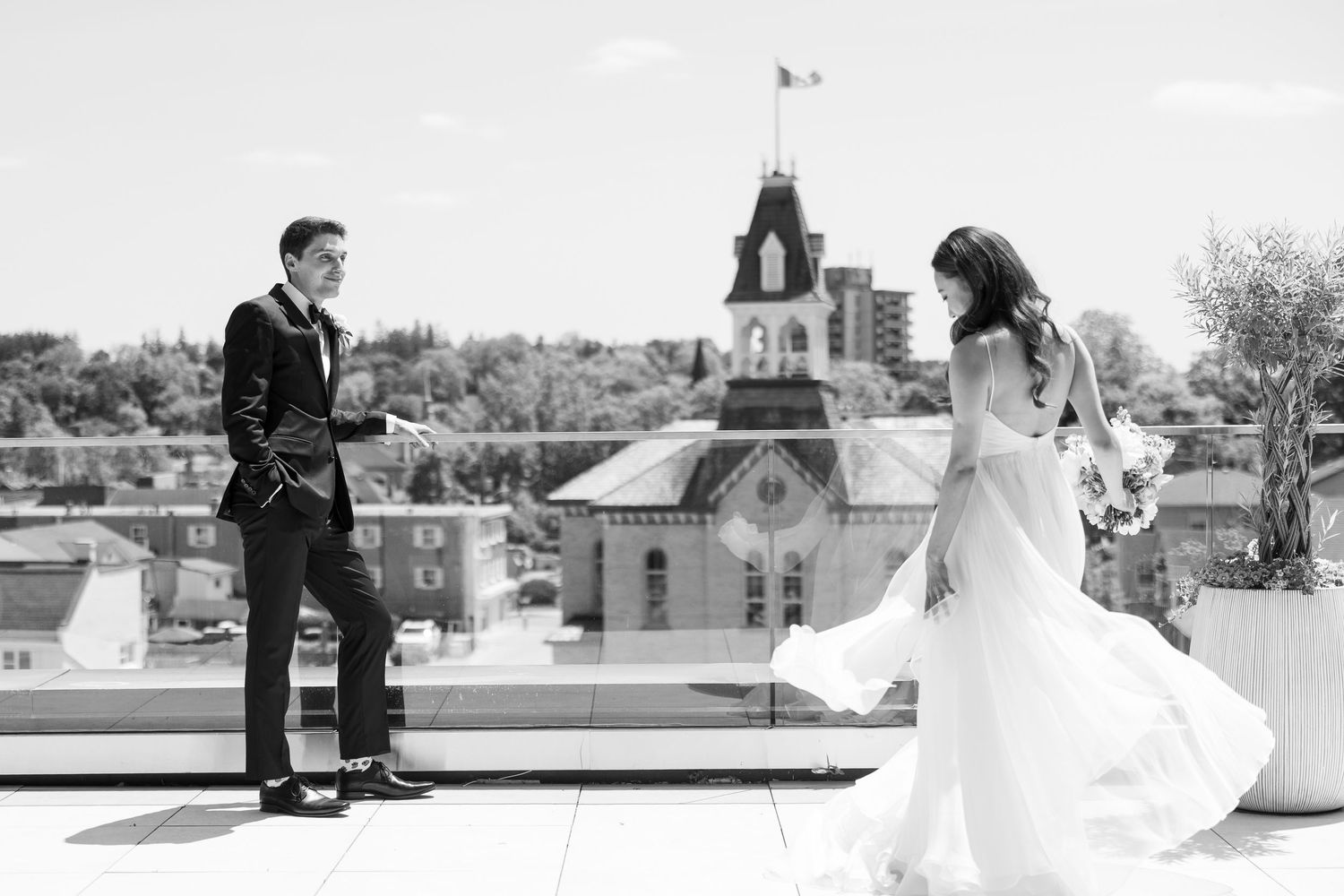 Elegant outdoor wedding couple sharing tender moments across multiple frames in black and white photography.