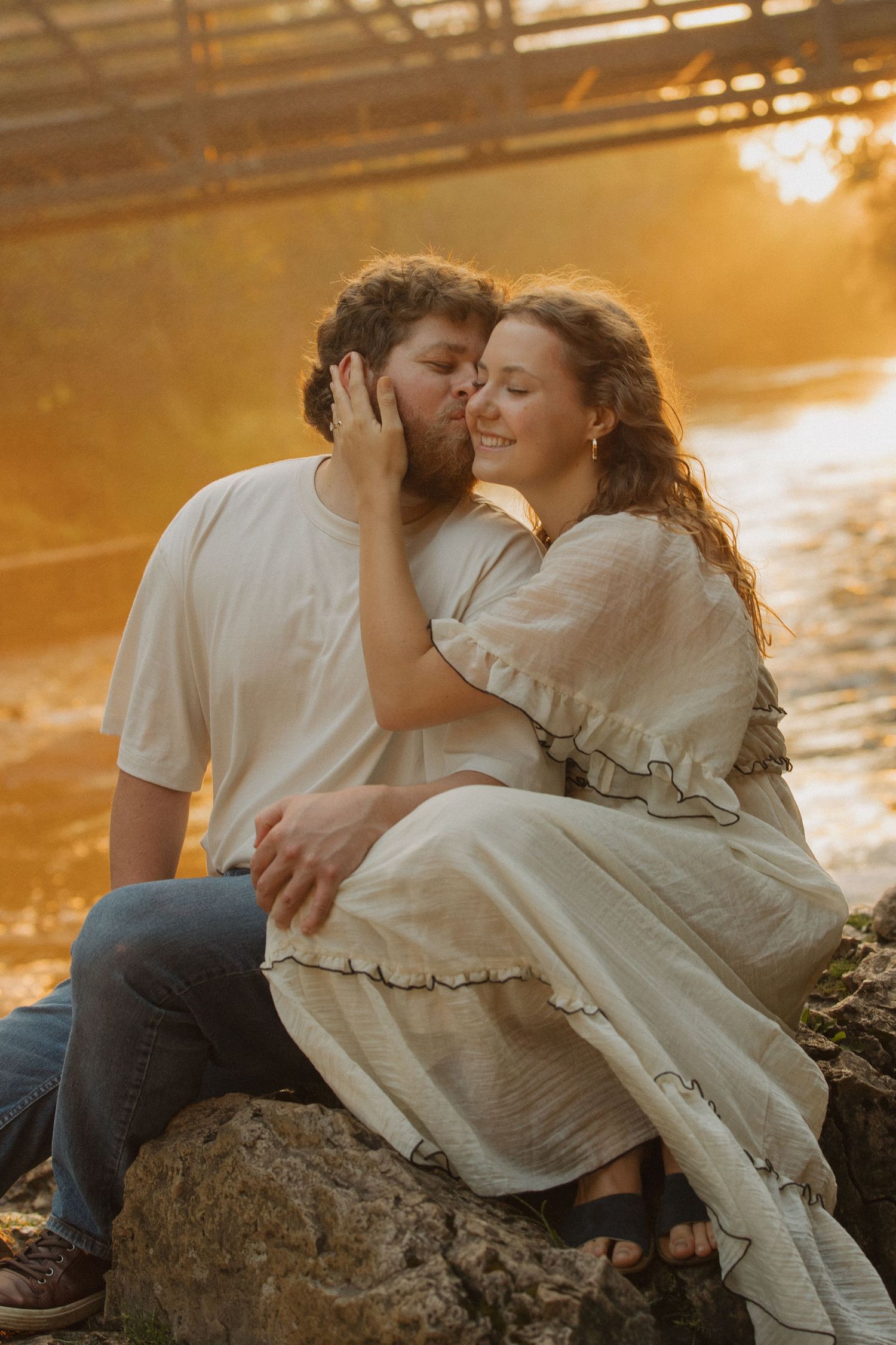 Intimate sunset moment captured on rocks by the water.