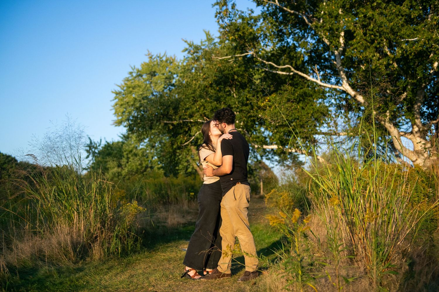 Couple posing for engagement photo session in Grand Rapids