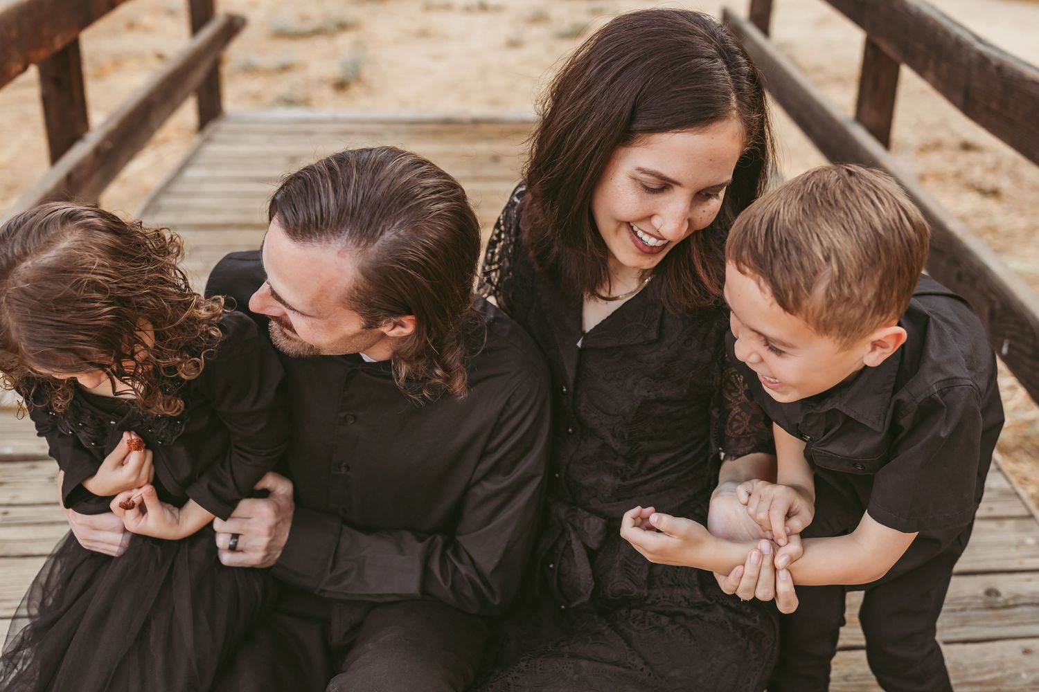 Sequence of photos showing a couple in black clothing embracing and laughing together on a wooden deck.