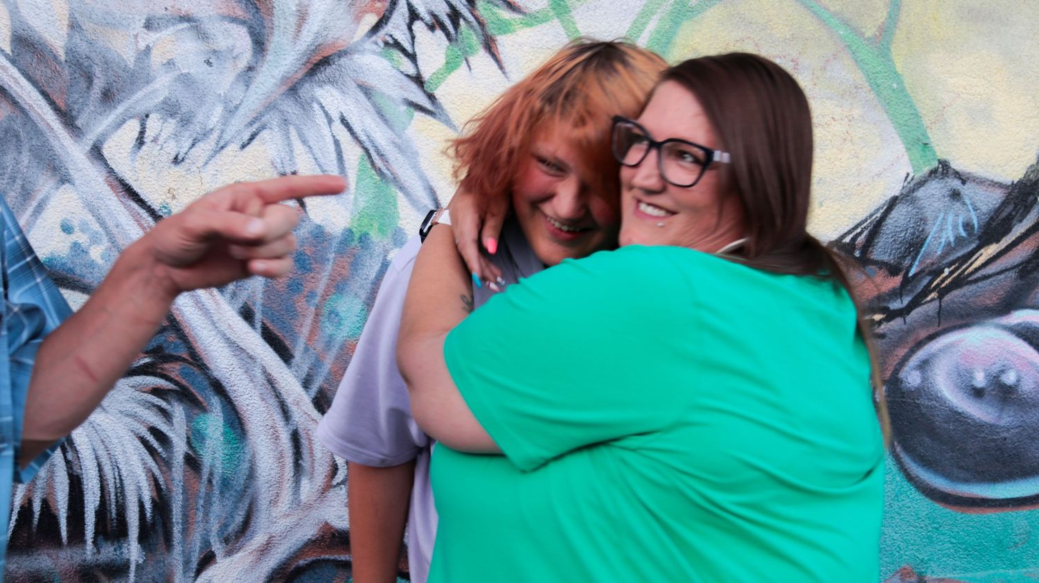 Teenage son hugging his mom during a candid family photo session in Salt Lake City, Utah