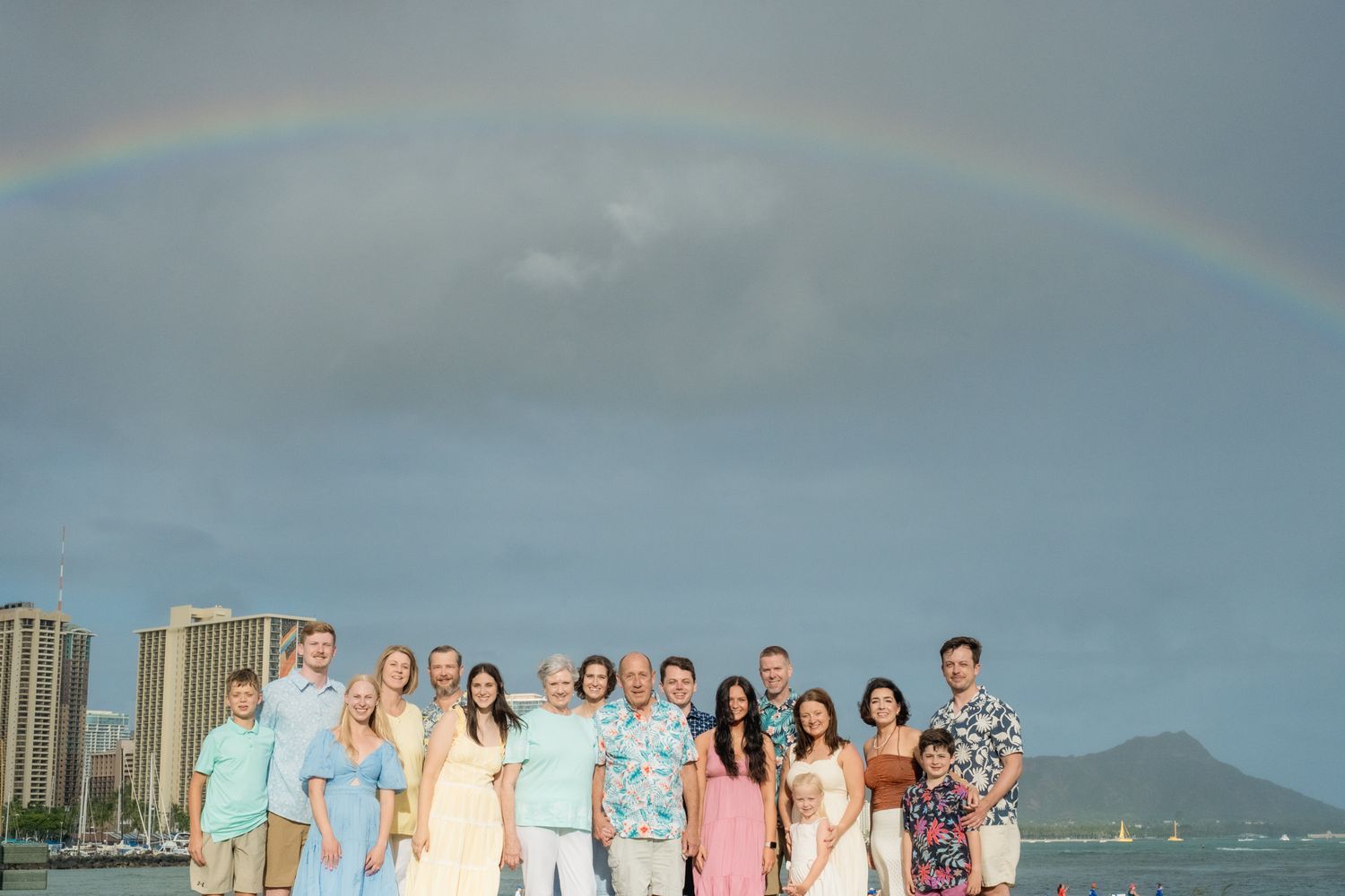 Group family session under a rainbow with Diamond Head in the Background.