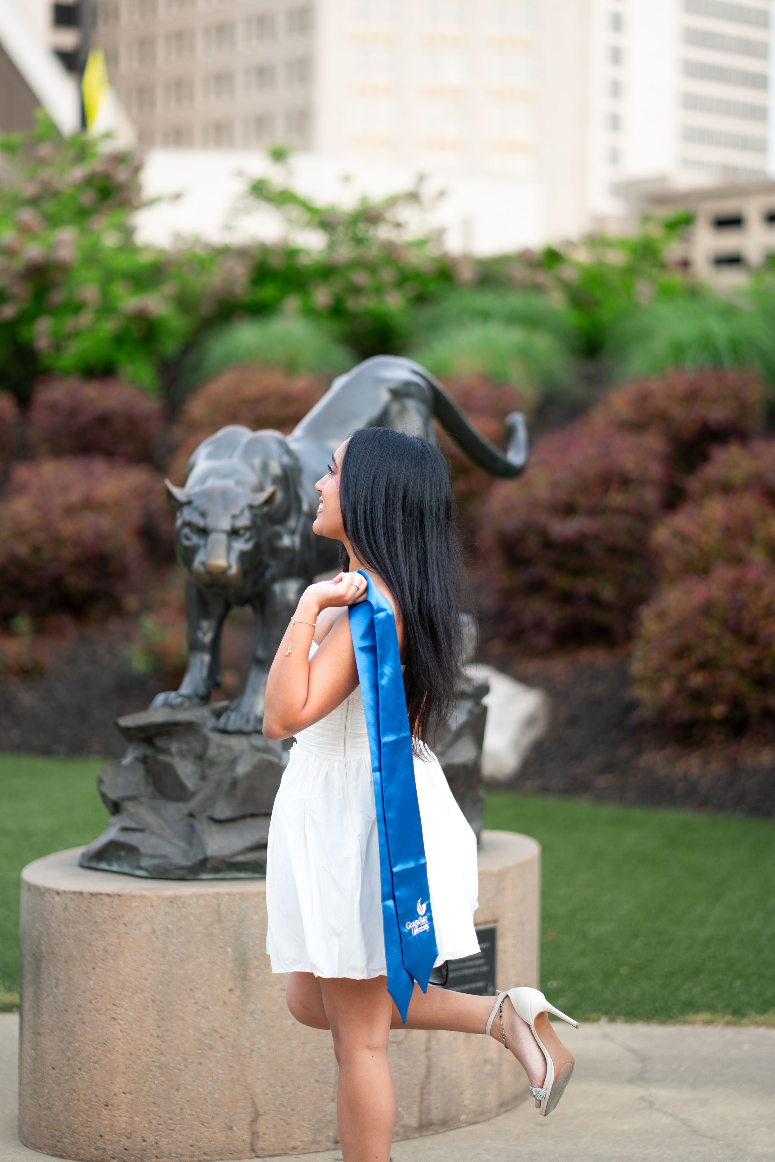 Georgia State graduation photos in front of the iconic student center panther sculpture