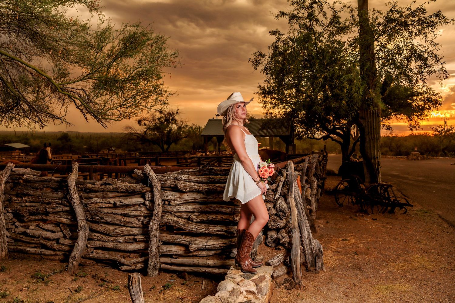 Western Tucson Senior pictures session in the Desert with stormy sky at Tanque Verde Guest Ranch