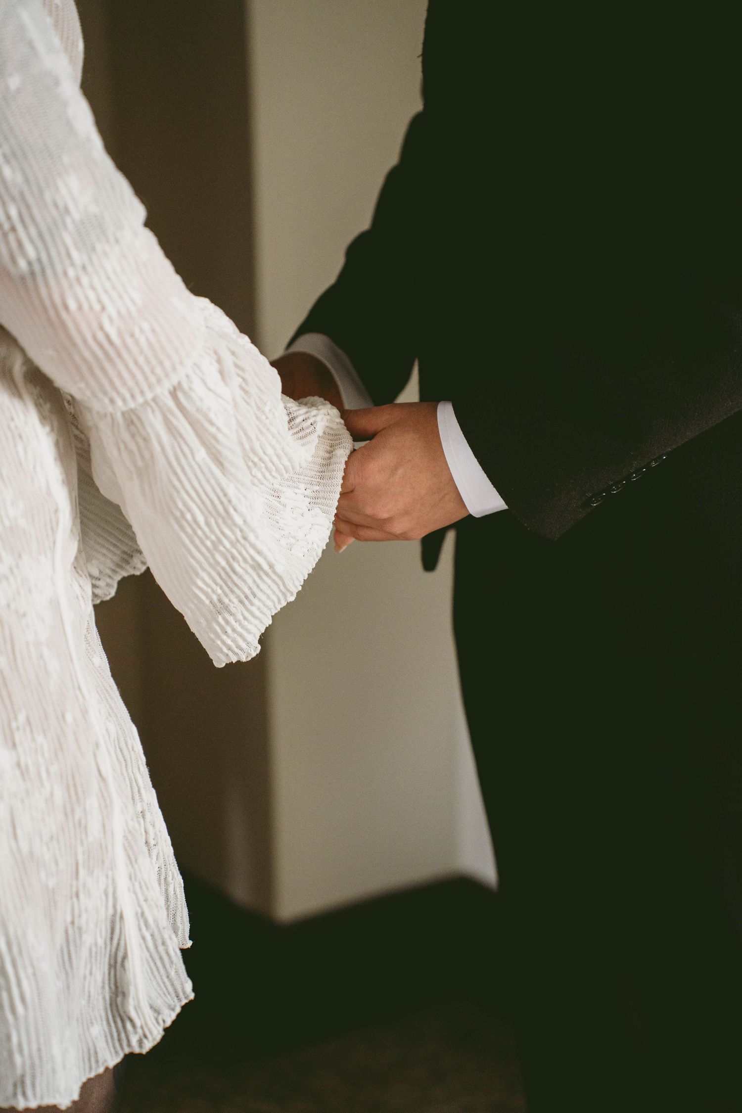 A couple during an elopement holding hands during their ceremony. Located in Dayton, Ohio.