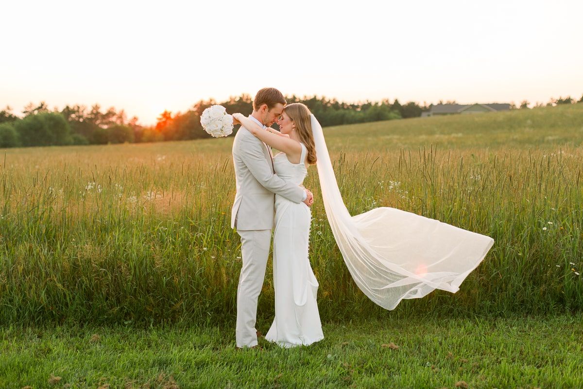 Nate and Jenna embrace during sunset at Lilydale