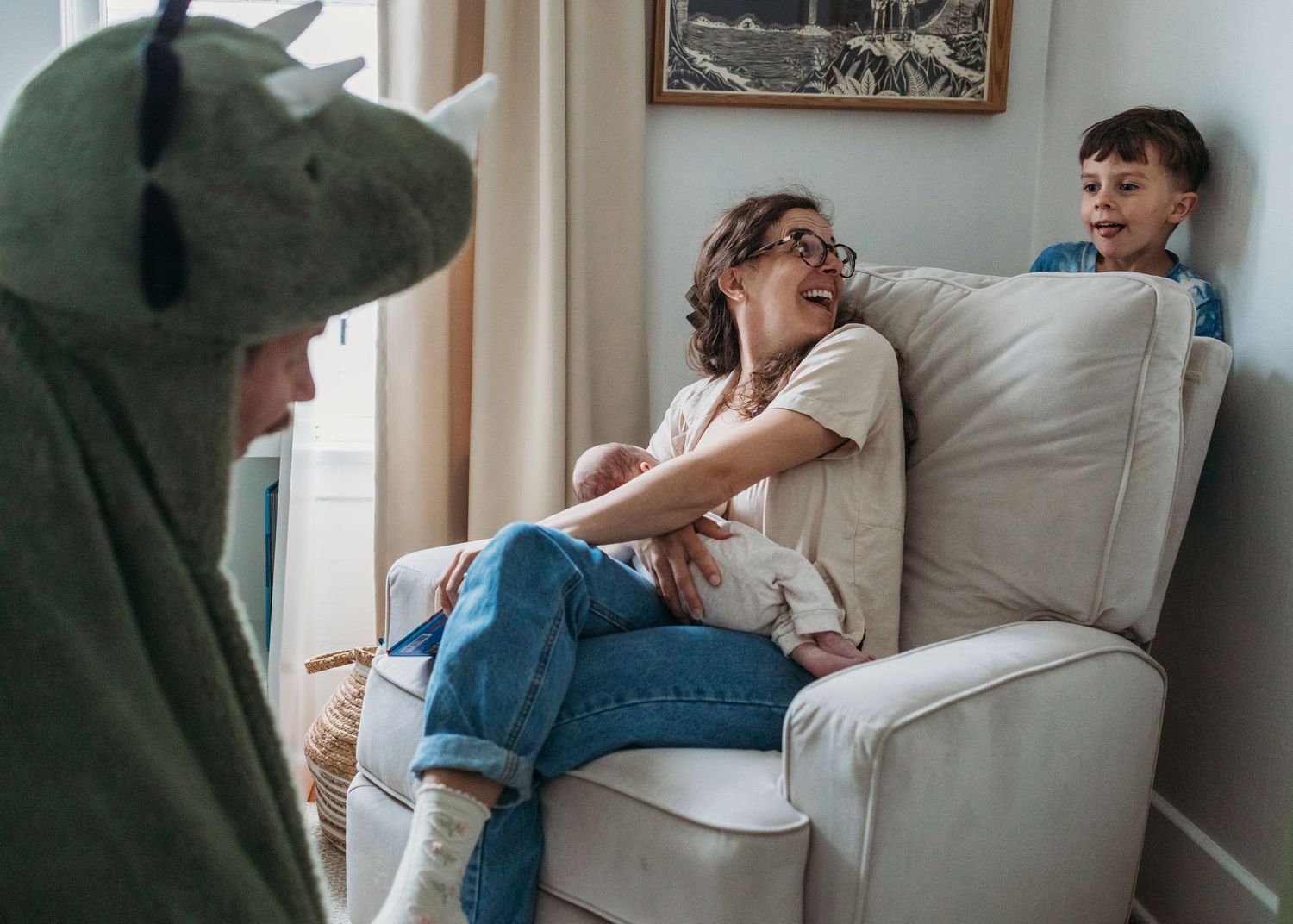 Two people relax together on a cozy beige couch while sharing a moment.