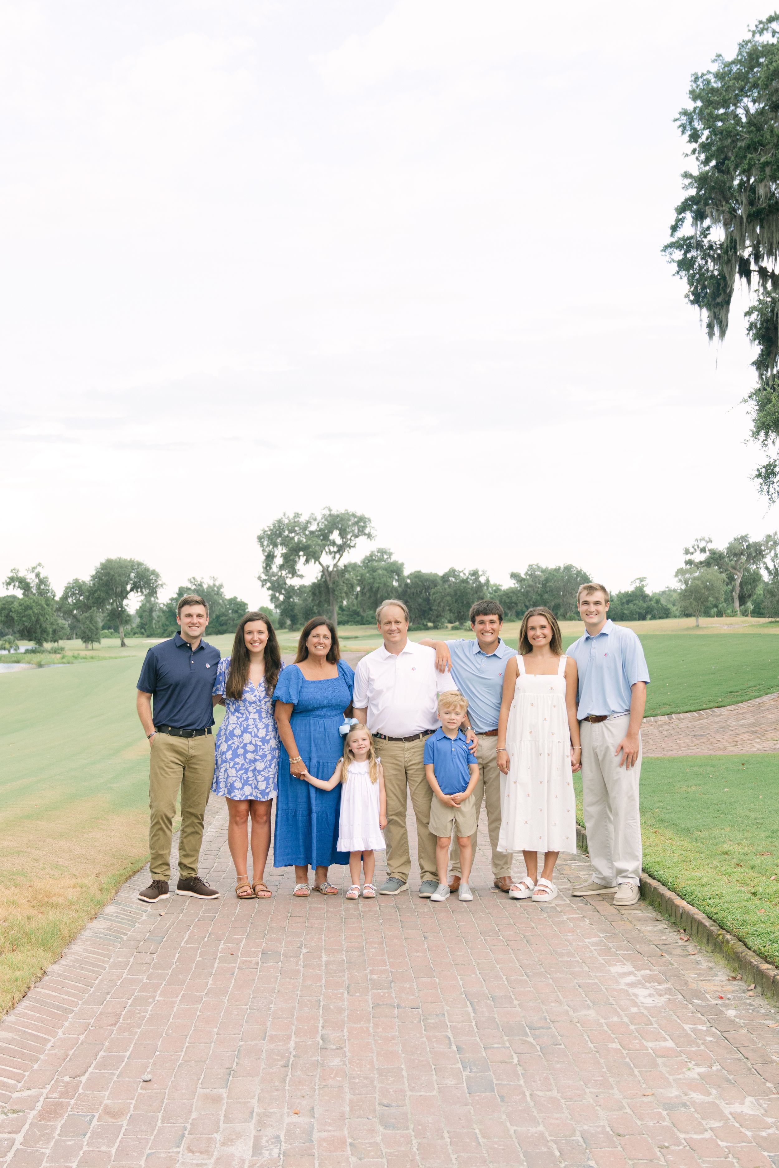 Smiling, candid and laughing family portrait session in a candid natural grassy location in southern georgia, extended family portraits ssi