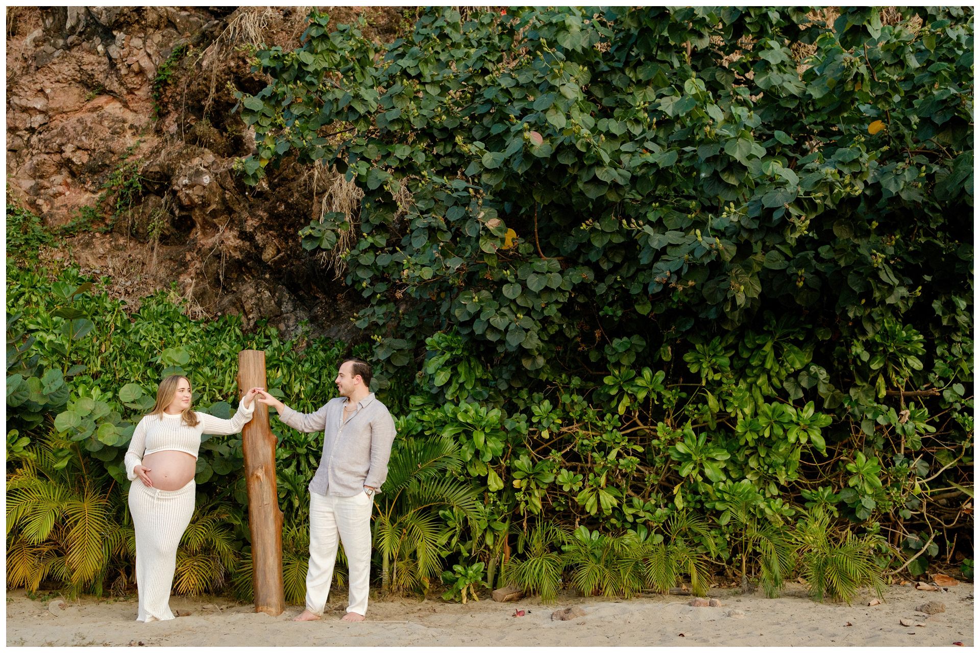 One & Only Mandarina family photographer capturing timeless maternity photos on a quiet beach with soft ocean waves.