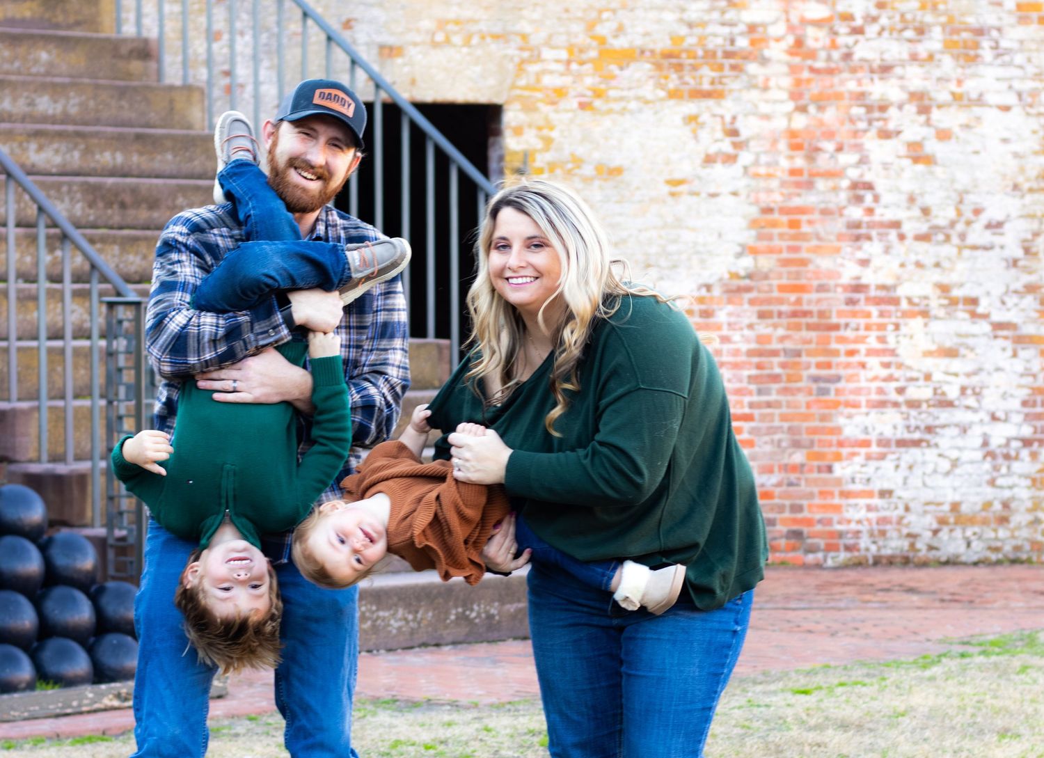 A couple in casual attire embracing and laughing with kids. Family Photography, kid photography, child photography