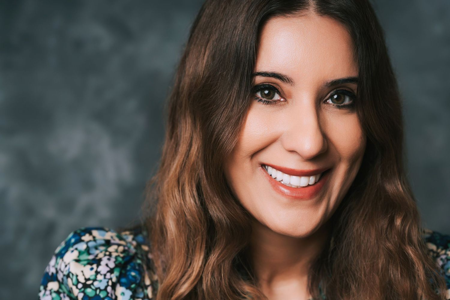 Professional headshot series showing the same woman in different poses against a gray background with natural lighting.