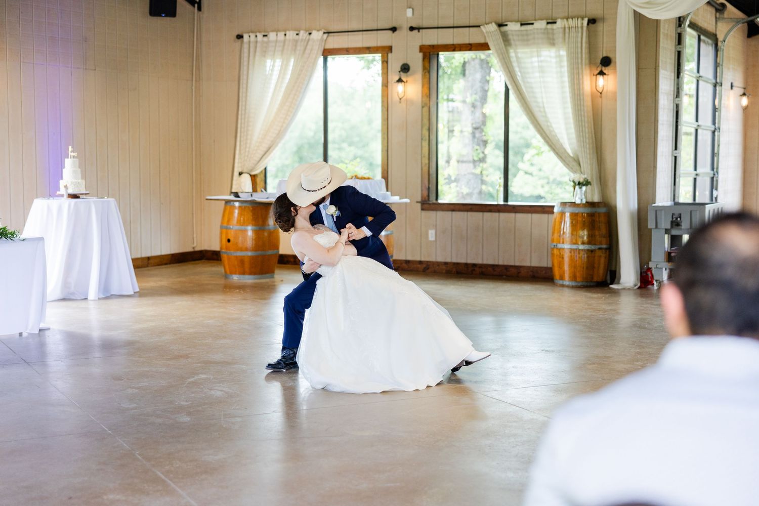 Elegant dance sequence captured in a bright ballroom with white curtains and hardwood floors.