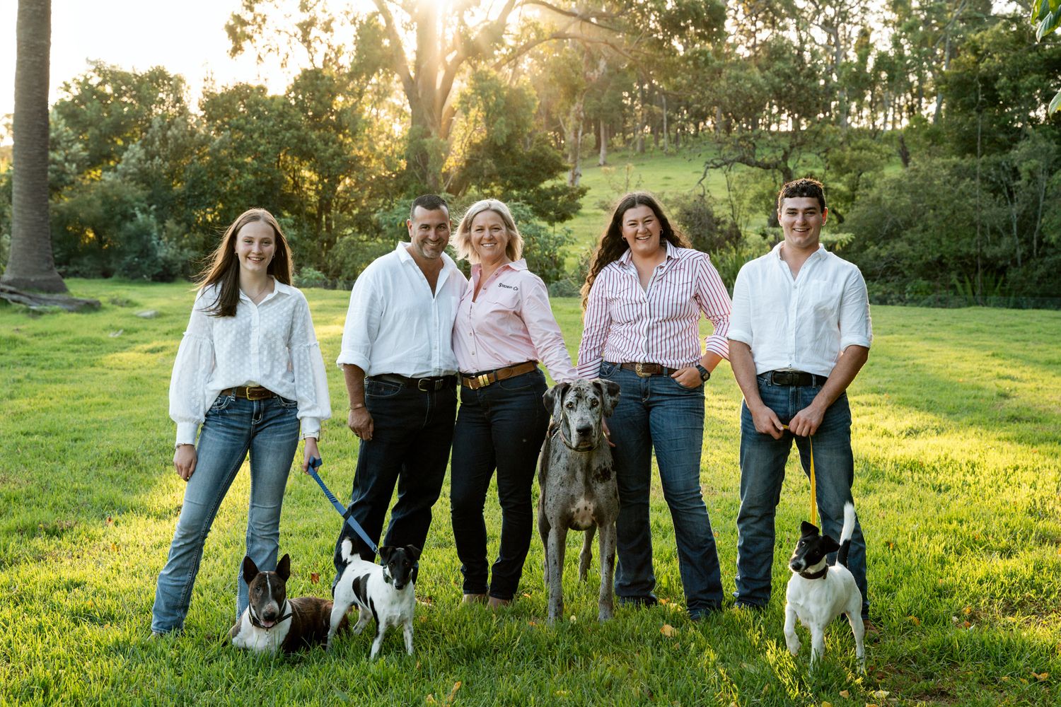 Family photoshoot with 3 teenagers 4 dogs and mom and dad at Mangrove Mountain Central Cost NSW
