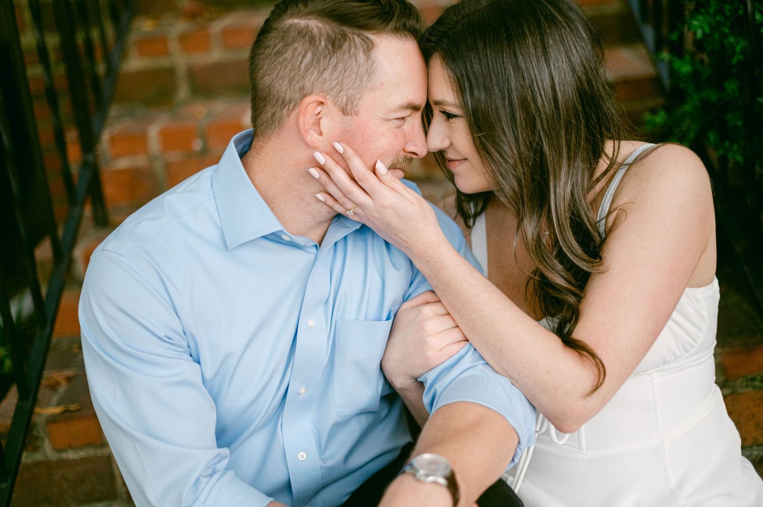 A romantic close-up moment captured against a soft background.