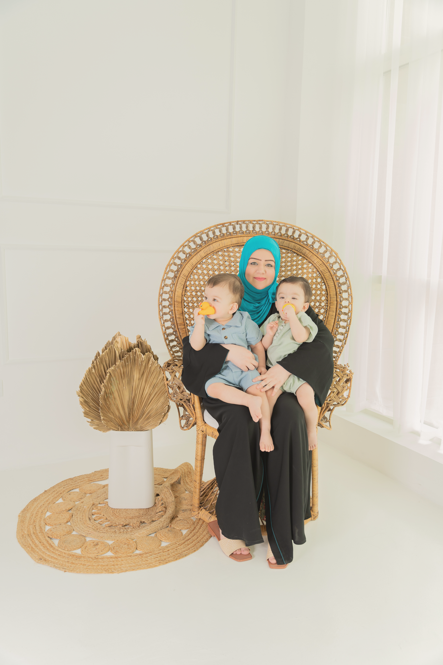 Family photographer Dubai capturing newborn and family portraits at home and in-studio with Mohastudio