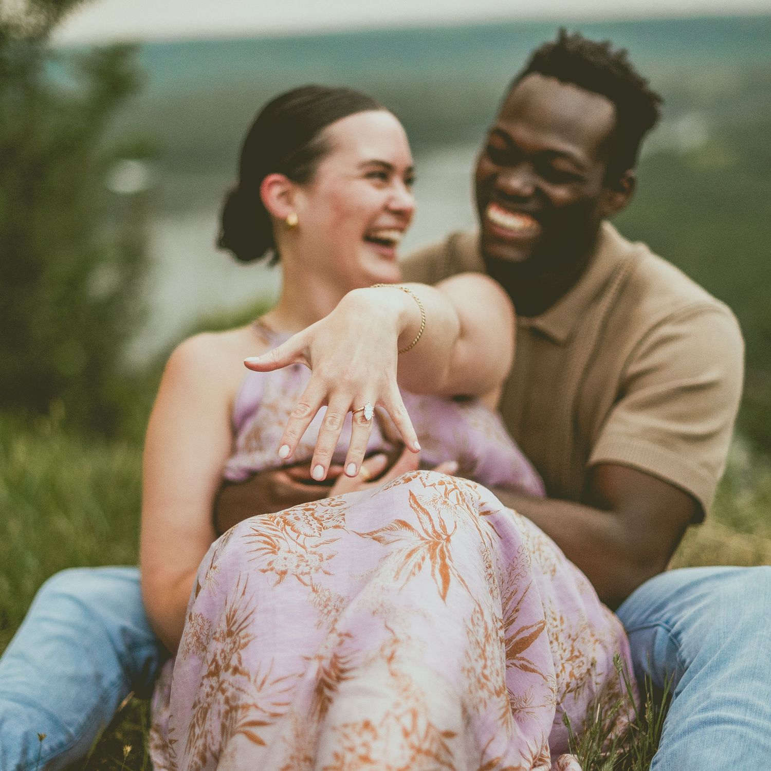 A group poses together outdoors in St Albert in coordinated pastel outfits for a casual family photo session in a natural setting.