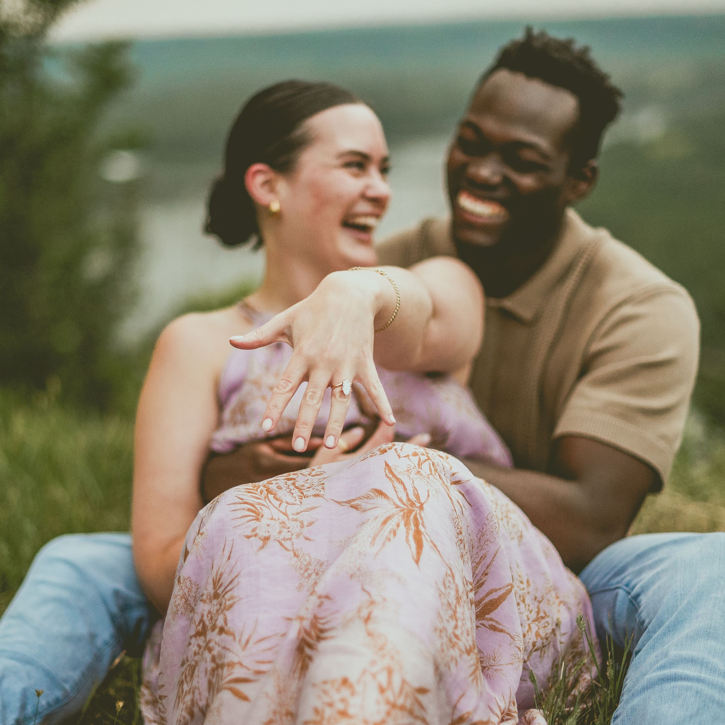 A group poses together outdoors in St Albert in coordinated pastel outfits for a casual family photo session in a natural setting.