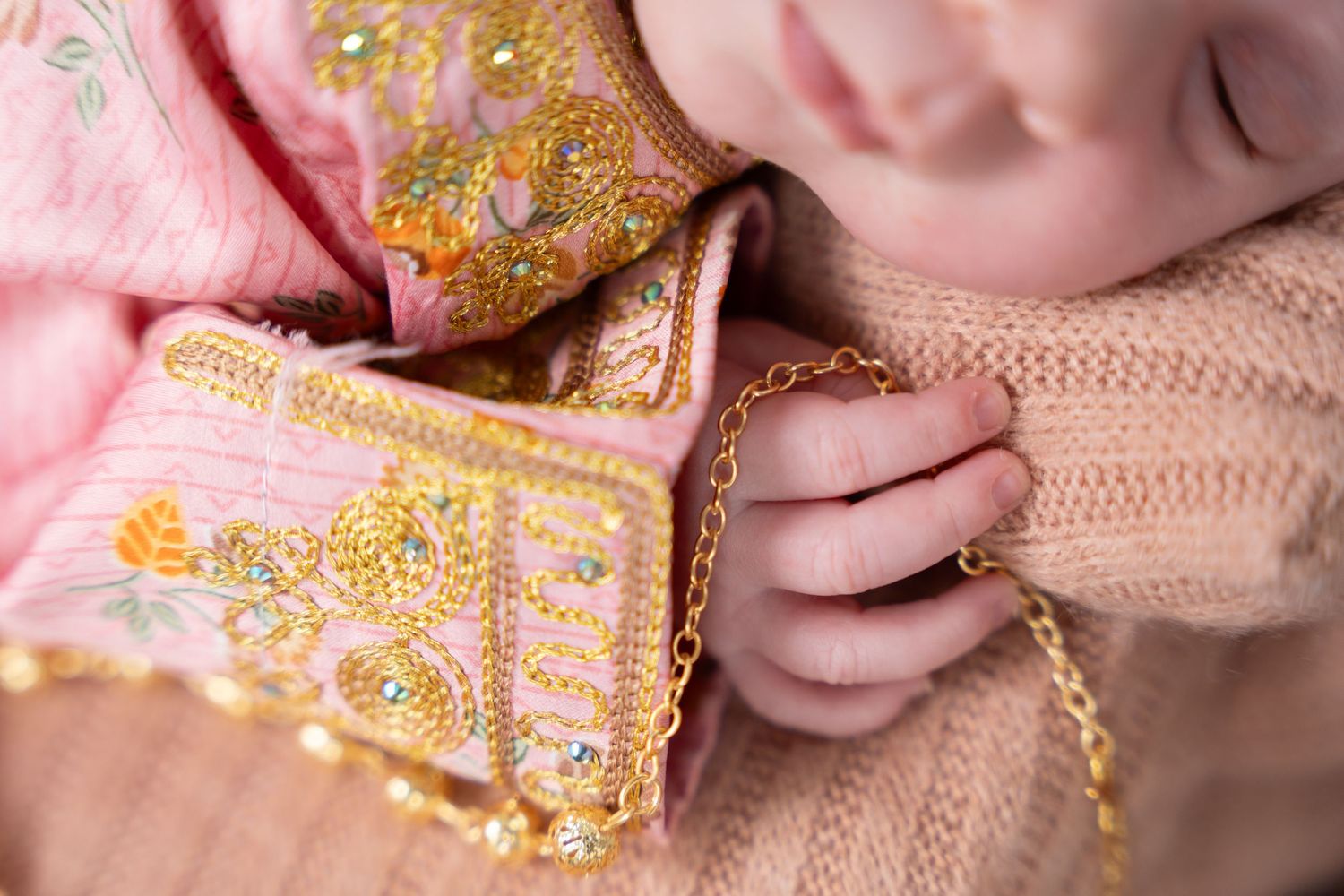 Precious newborn baby peacefully sleeping during a new born photoshoot Dubai session.