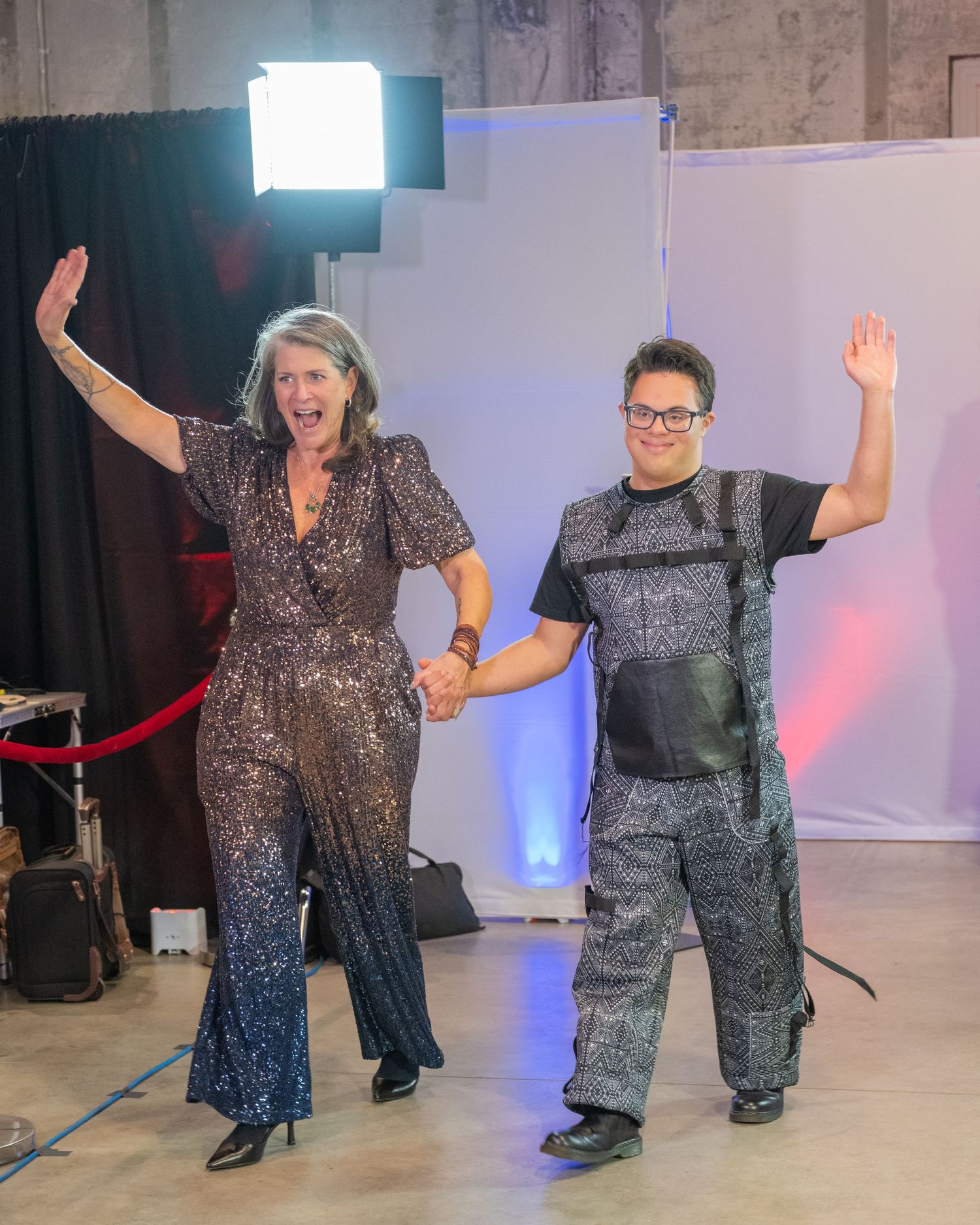 Two people walking in a Boston fashion show