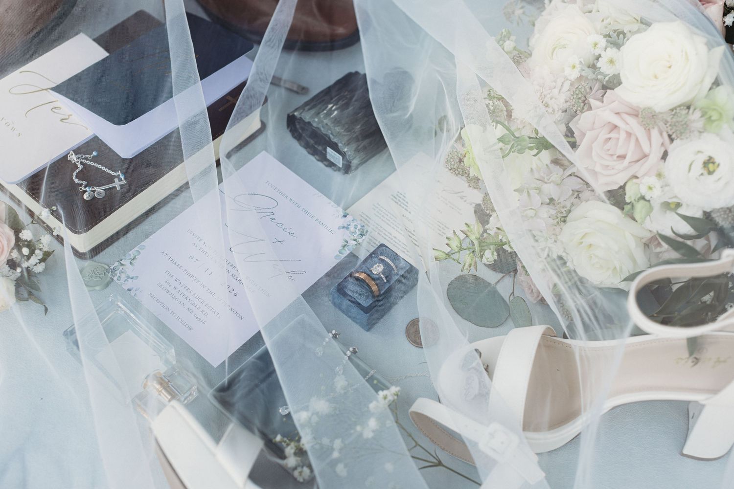 Wedding day flat lay with all the details and important heirlooms of the wedding day in skowhegan maine