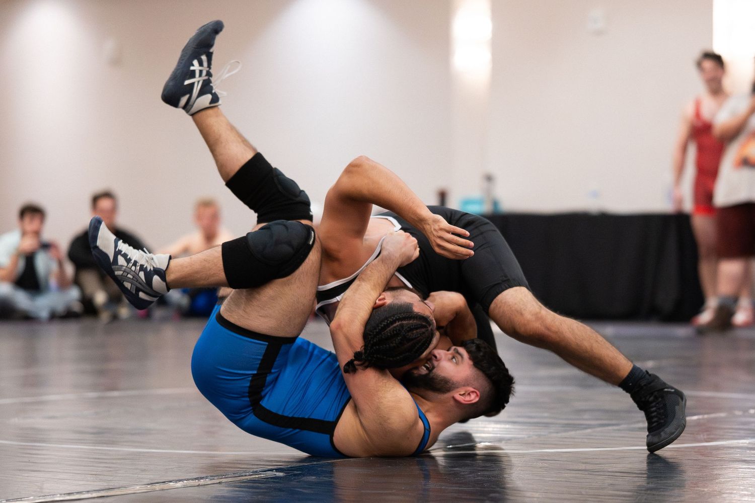 Two wrestlers competing for dominance in a tournament at Sin City Classic hosted by Wrestle Proud and District Wrestling