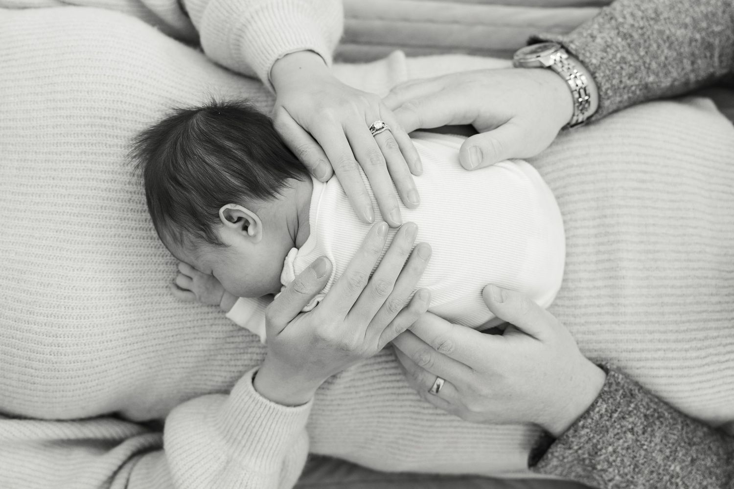 A mother breastfeeding her baby in a series of black and white photographs showing different nursing positions.
