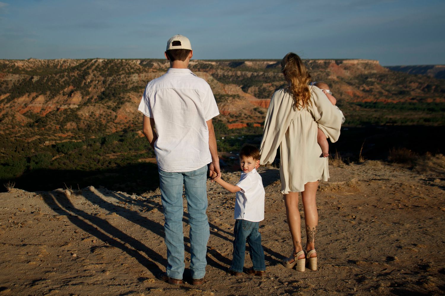 A family of four during a family photo session at Palo Duro Canyon State Park in Canyon, Texas