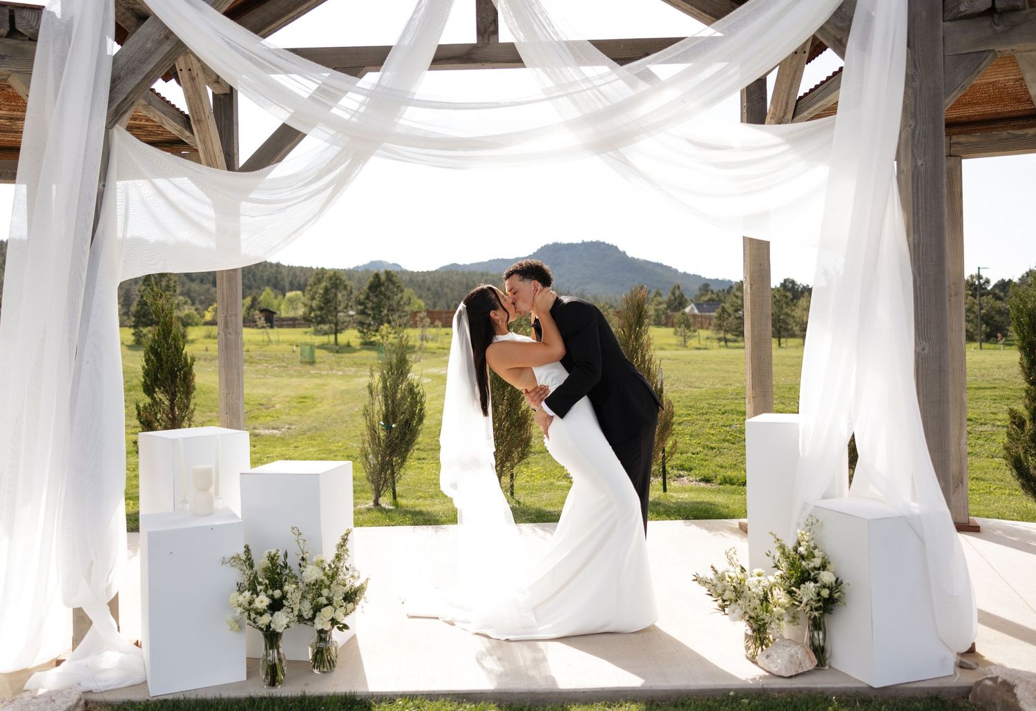 Delicate white roses and flowers arranged in an elegant monochromatic display.