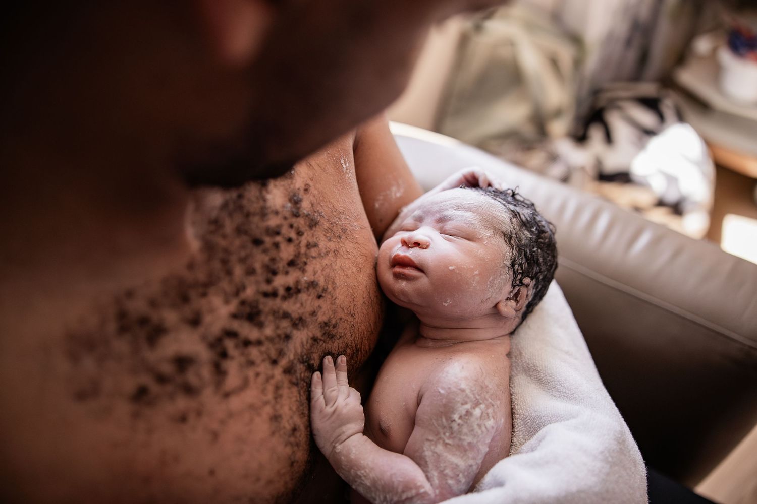 cape town birth photographer newborn skin to skin on dads chest