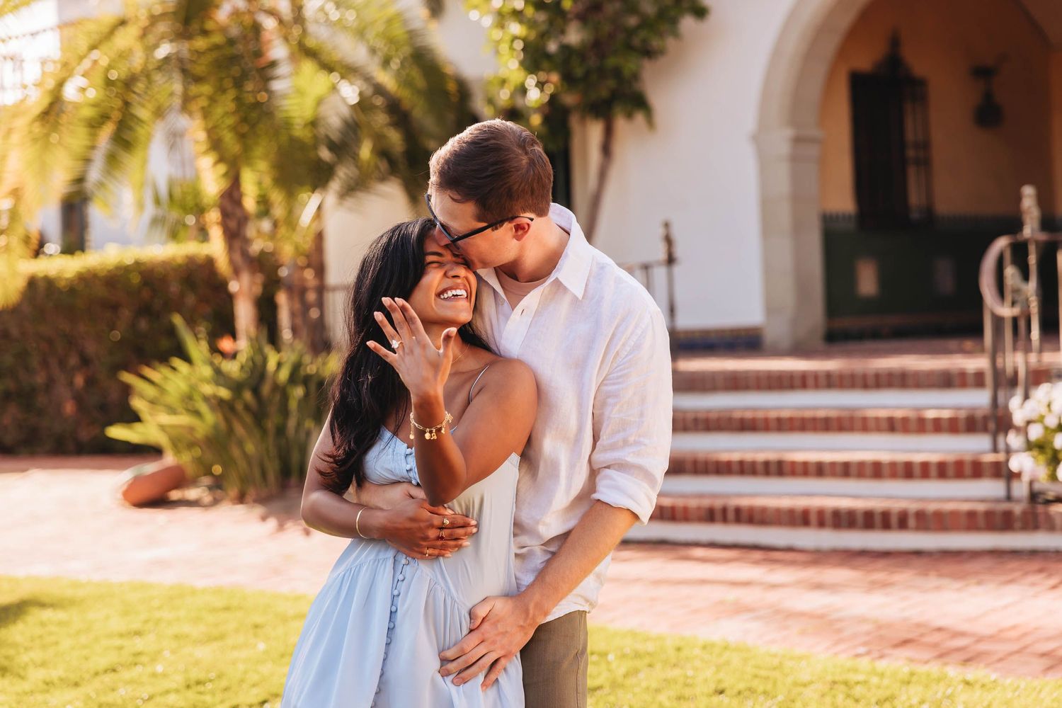 Surprise proposal photo shoot ideas from a Santa Barbara Photographer. Photo of couple kissing on beach.