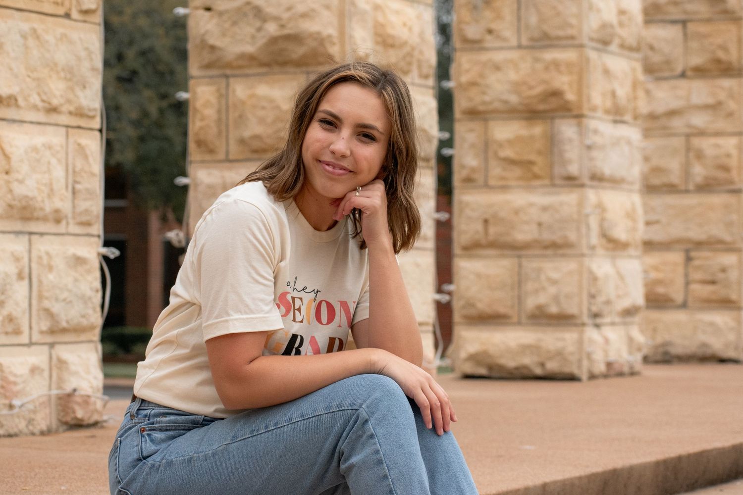 Masters graduate sitting at University of Mary Hardin Baylor in Belton Texas