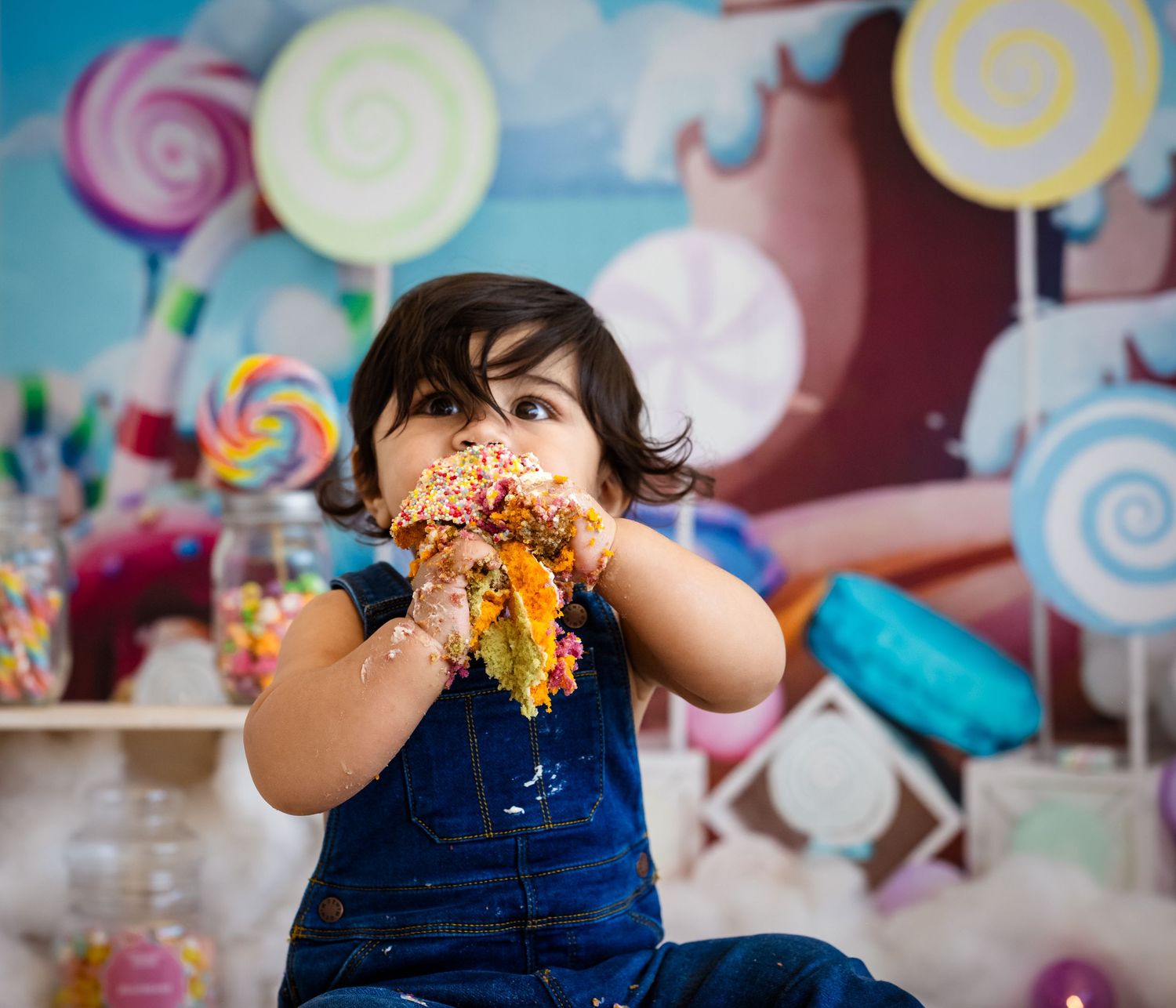 Colorful rainbow decorations and party setup for a celebration.