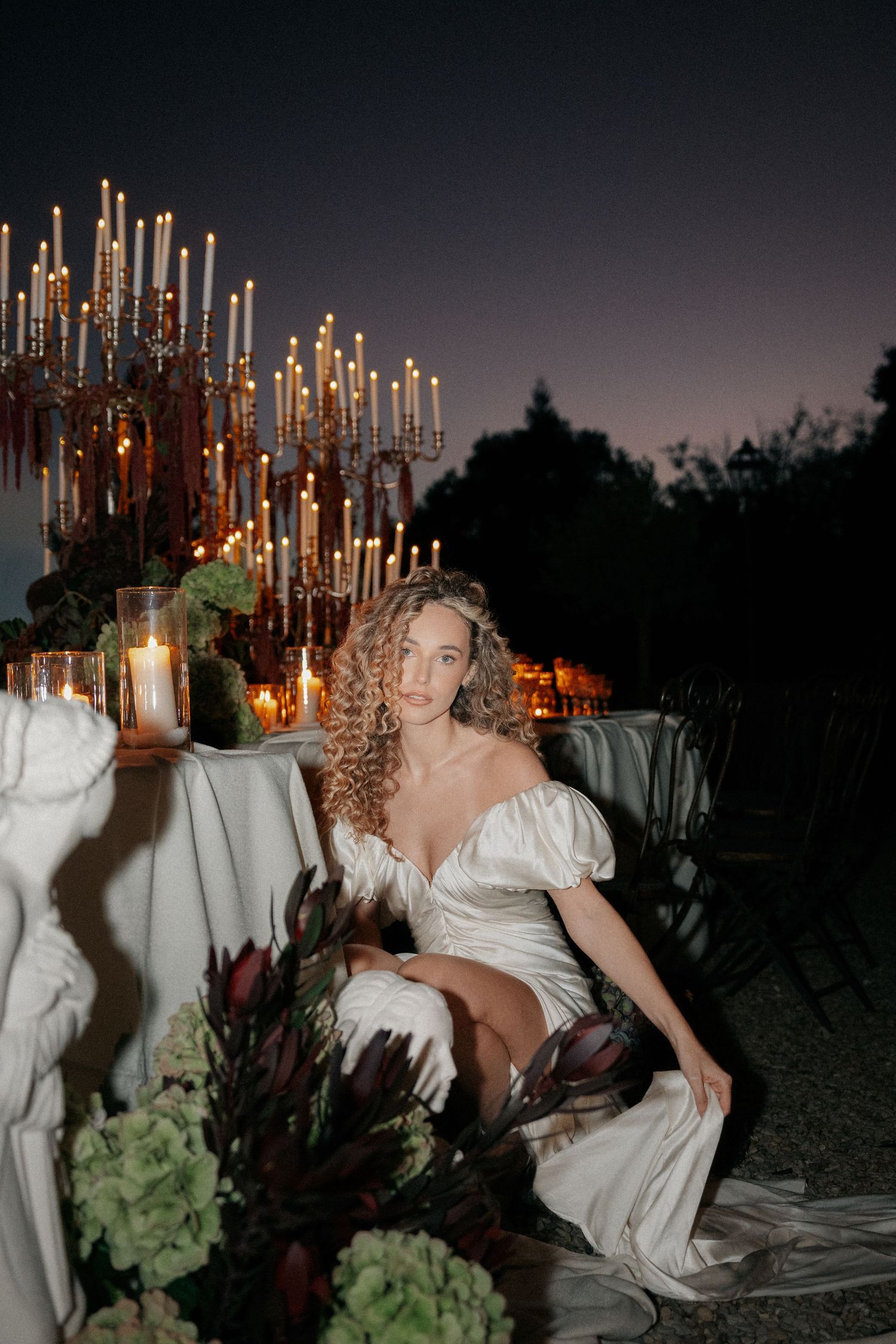 Lee and Leandro — wedding reception tables with candlelight and floral centerpieces, destination wedding dinner. POST-TALES WEDDS.