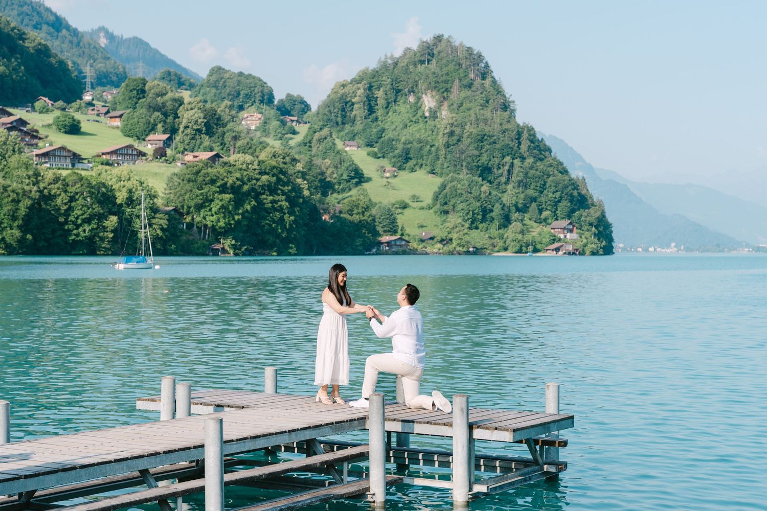 Surprise Proposal with panoramic view of snow-capped mountain peaks and valleys stretching across a rugged alpine landscape at Villa Honegg.