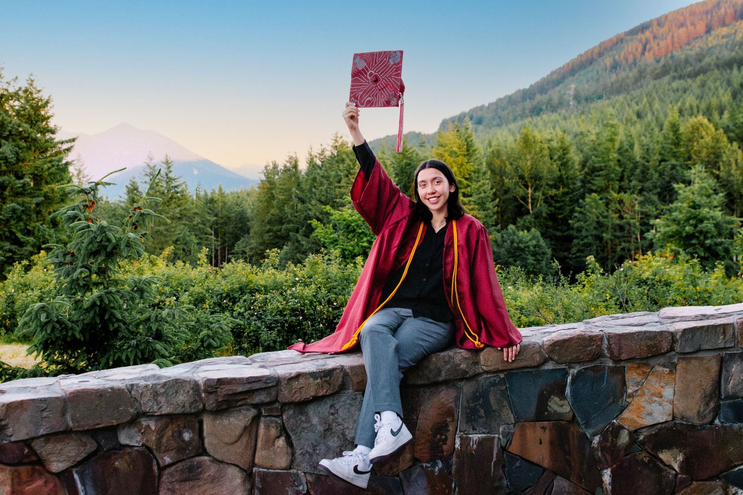 Senior graduation portrait with mountain backdrop at Snoqualmie Point Park