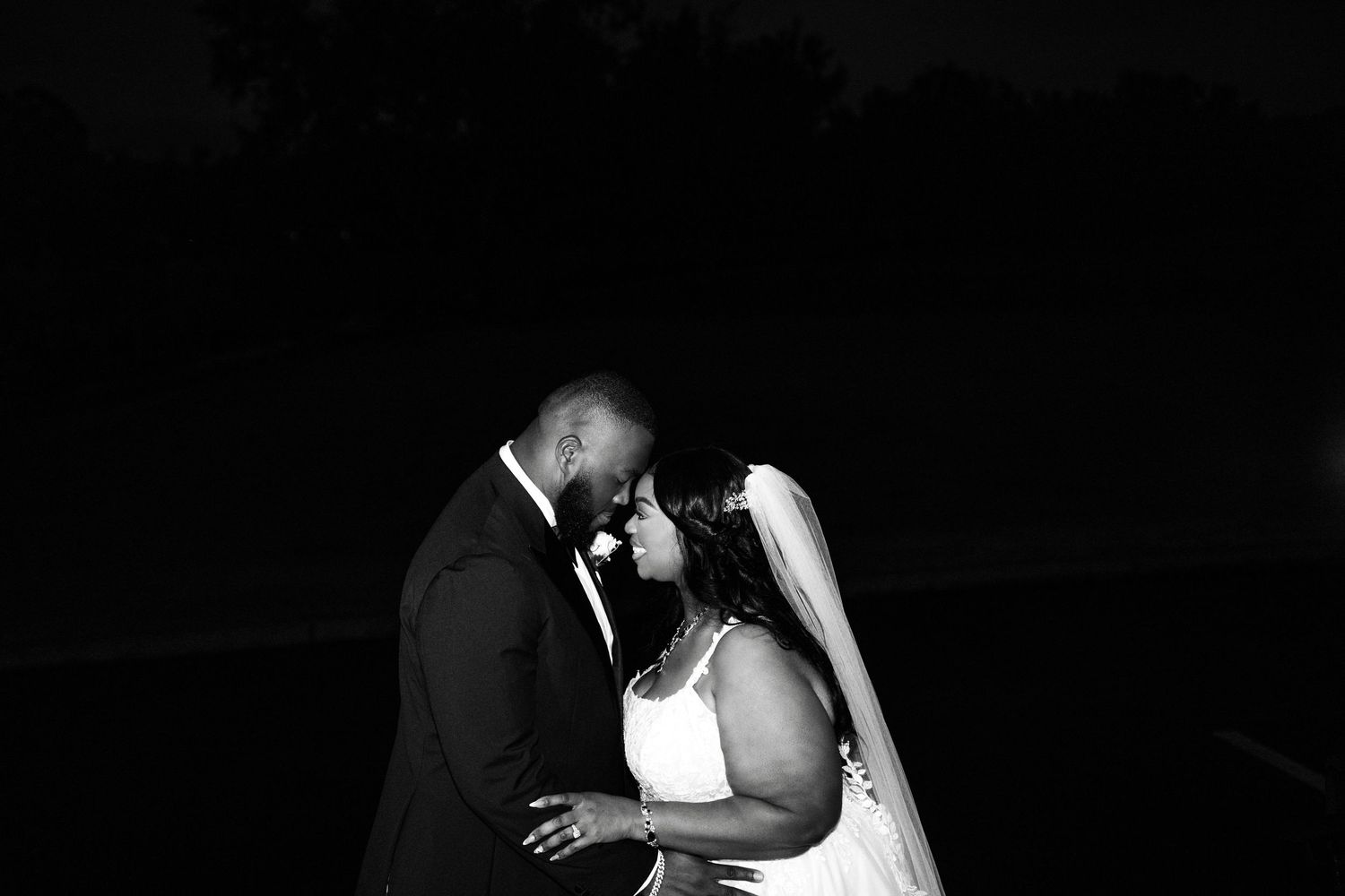 A romantic black and white photo series showing intimate moments between a couple sharing tender kisses.