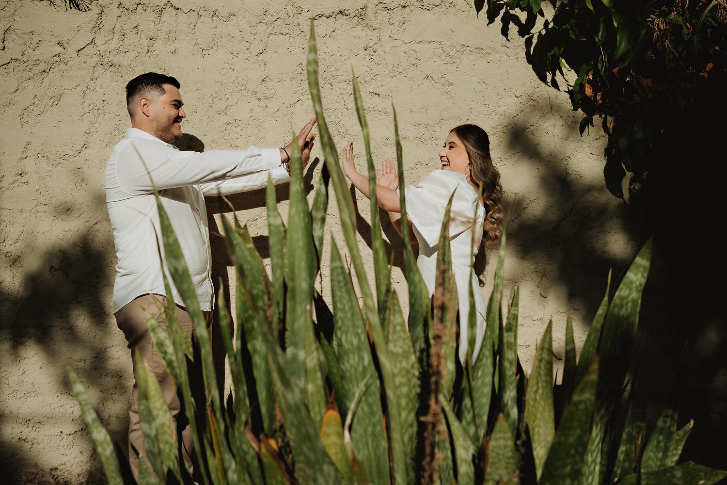 Couple playfully enjoying themselves, capturing a joyful and fun moment in this Mazatlán pre-wedding shoot