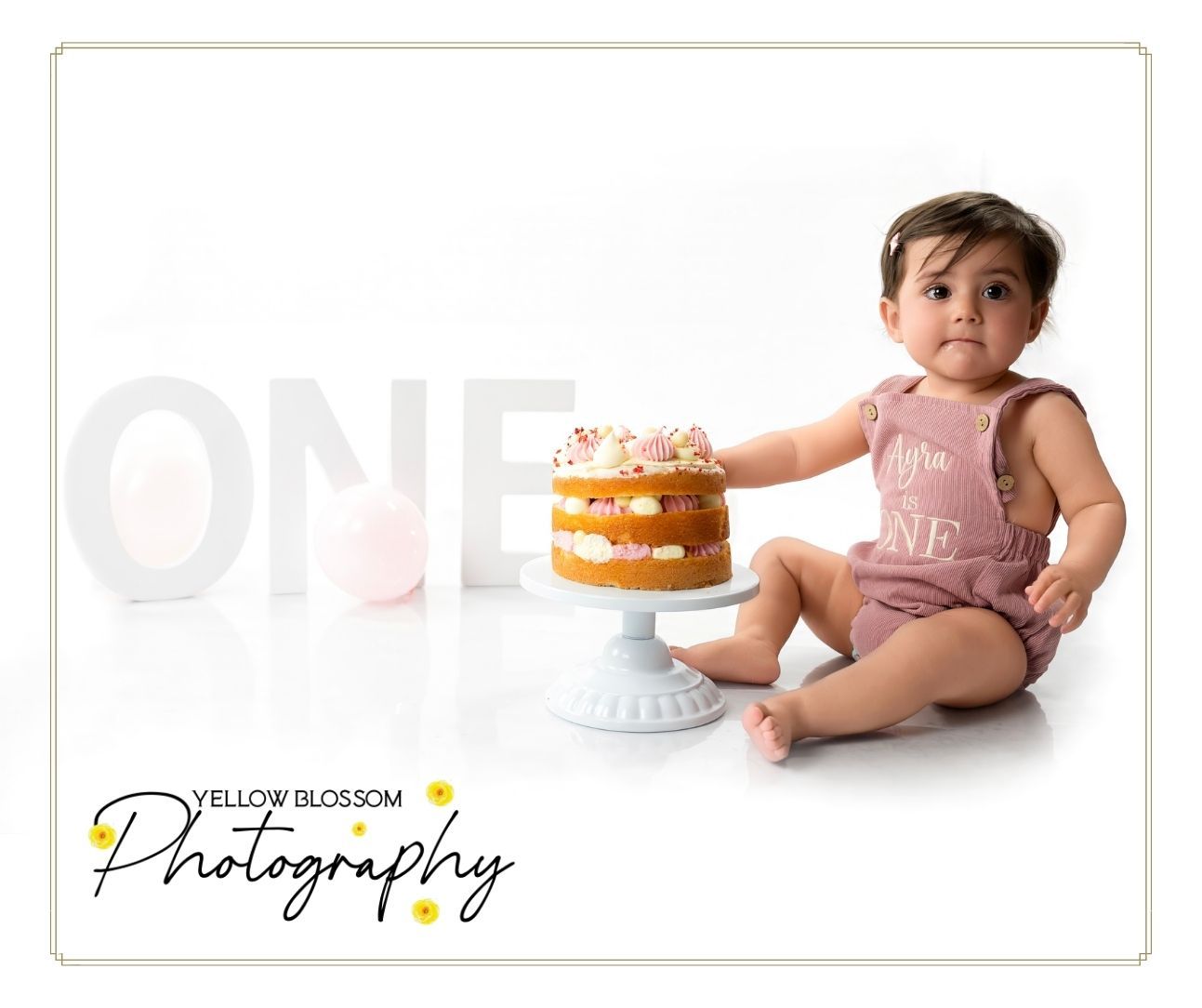 First birthday cake smash photography with balloons in Suffolk