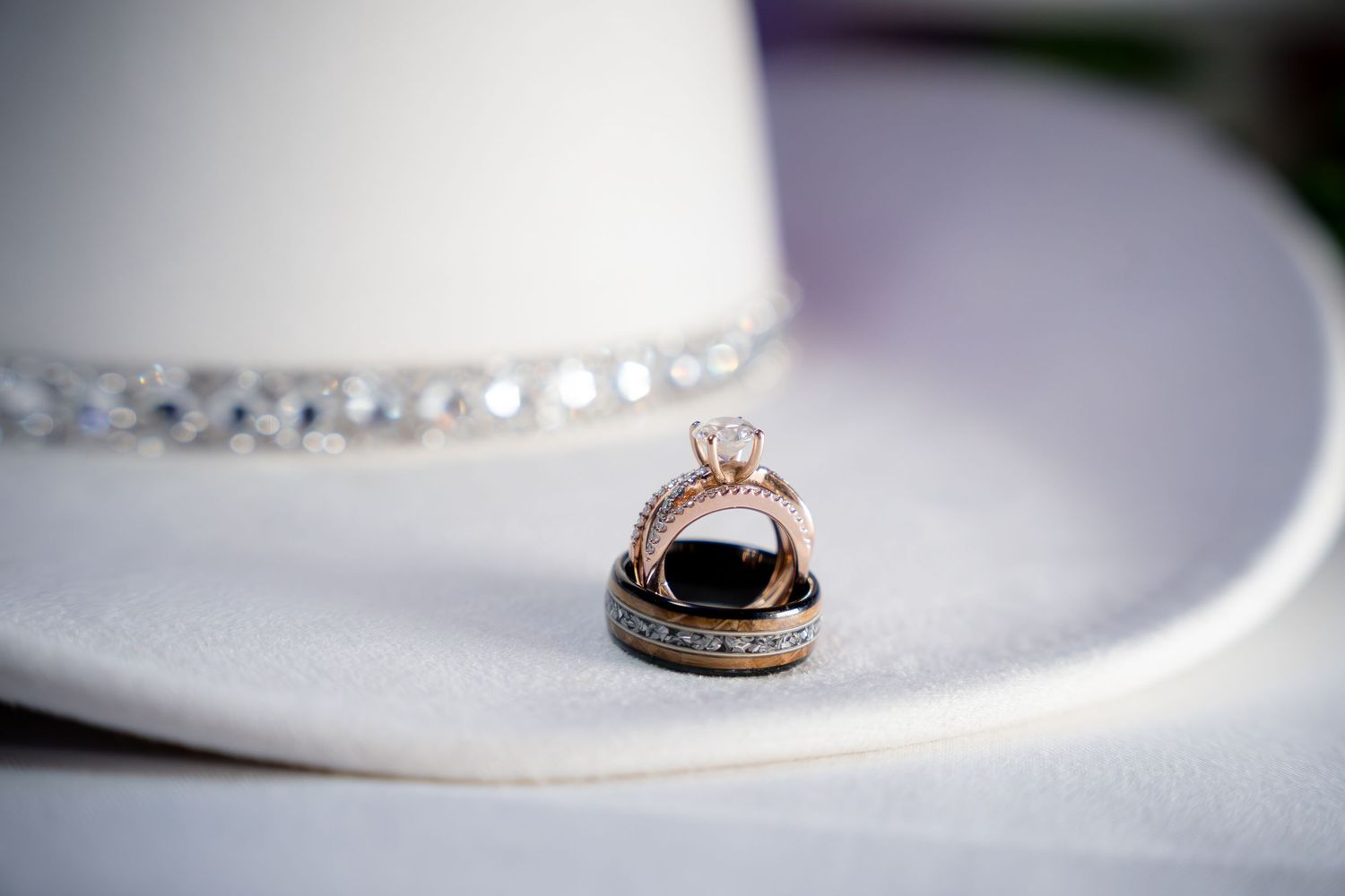 Folsom wedding photographer photo of wedding rings on cowboy hat.