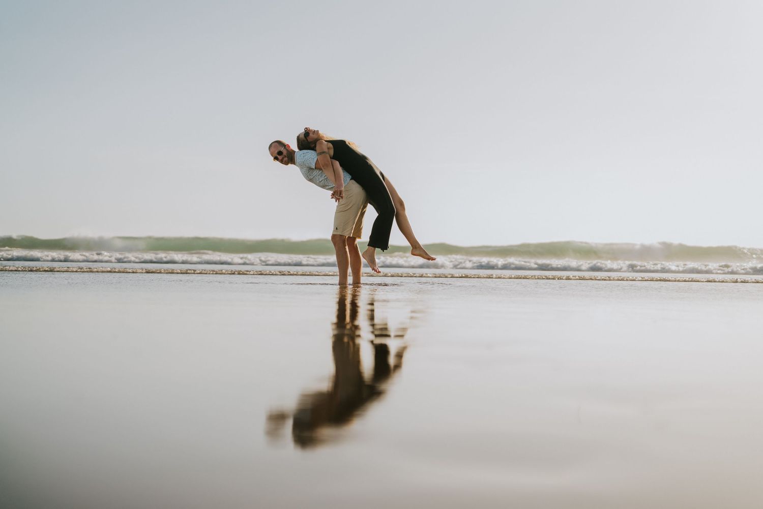 Minimalist beach scene with soft lighting and gentle waves.