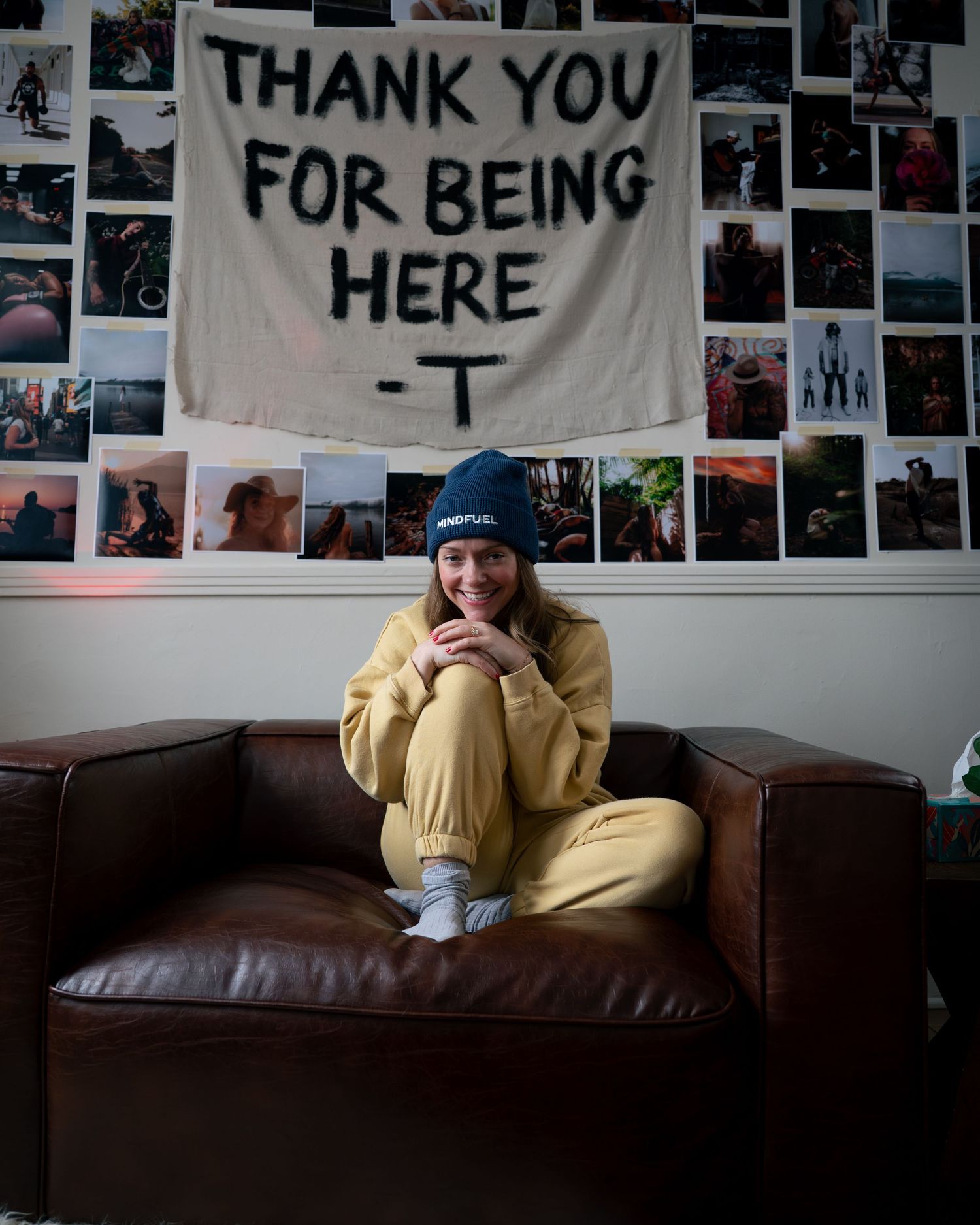 A series of four photos showing someone relaxing on a brown leather couch beneath wall decorations and banners.