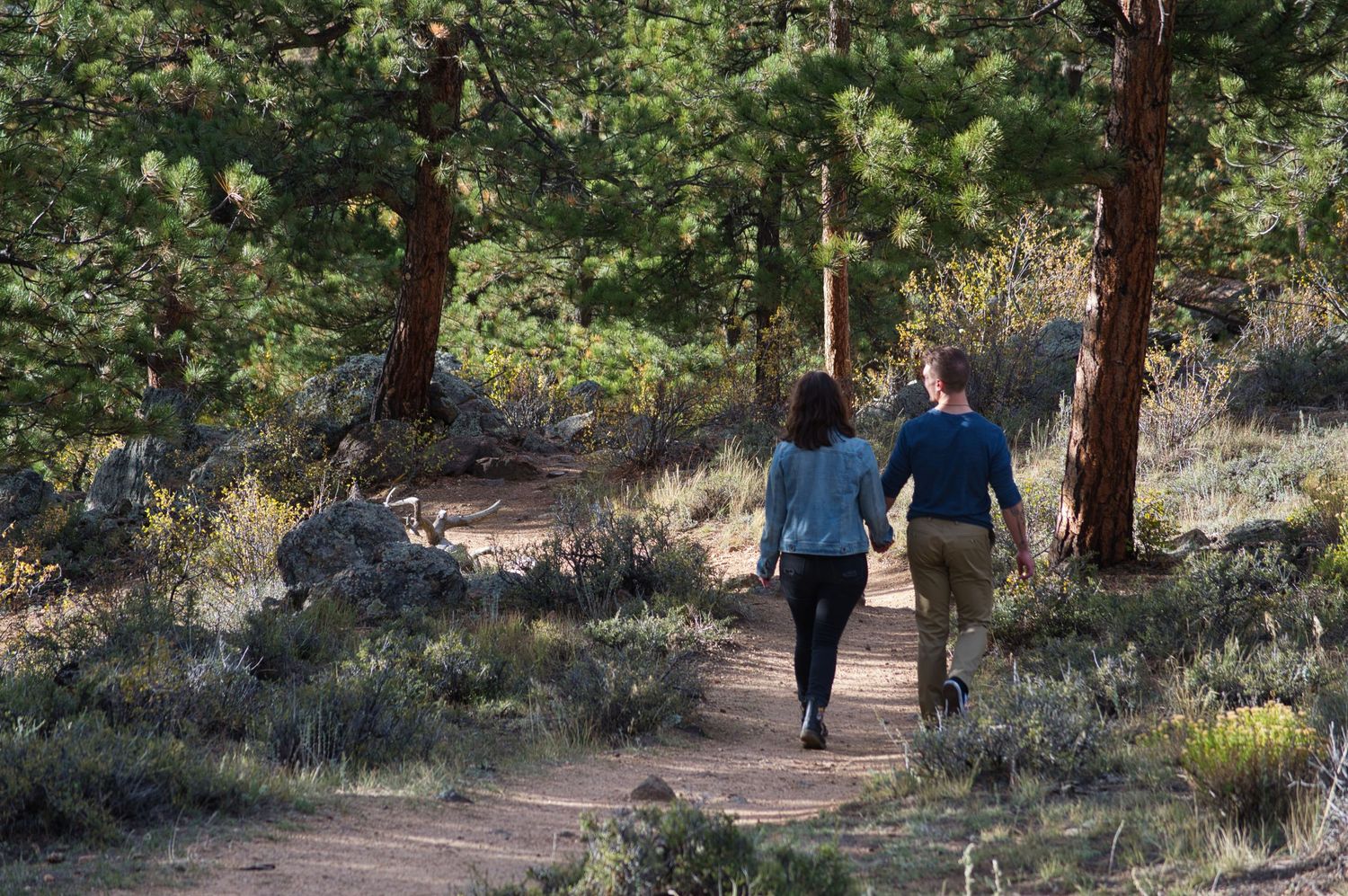 Couple walking on a trail in Estes Park Colorado.
Pixcapades | The Rocky Mountain Proposal Photographer