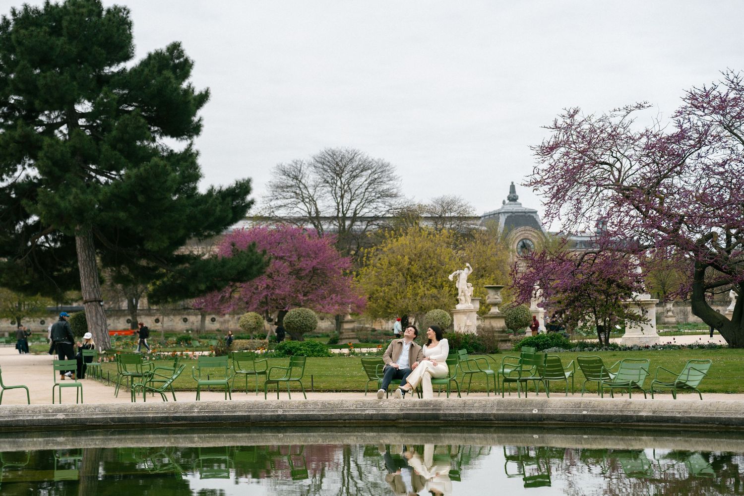 Paris engagement photoshoot fashion couple at Jardin des Tuileres Garden, editorial couples photoshoot in Paris, Paris film photographer