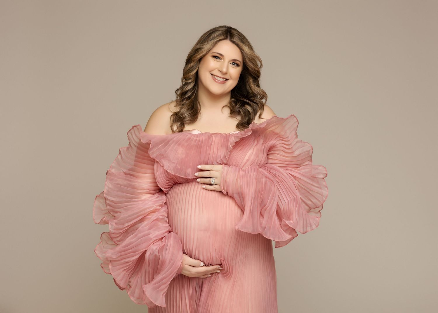 Maternity photographer in Oklahoma City capturing elegant studio pregnancy portraits