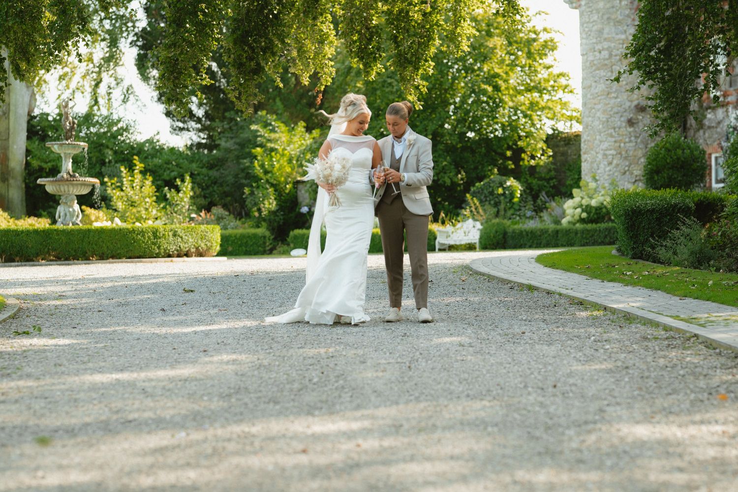 Emma and Michaela together in the courtyard at Ballymagarvey Village on their wedding day.